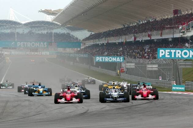 Startsituation Malaysia, v.li.: Michael Schumacher (Deutschland Ferrari), Juan-Pablo Montoya (Kolumbien BMW-Williams), Rubens Barrichello (Brasilien Ferrari) Motorsport Grand Prix Herren Großer Preis von Malaysia 2002, Formel 1 Weltmeisterschaft, F1, F, GP, WM, Vdig Totale International Circuit Kuala Lumpur Sepang