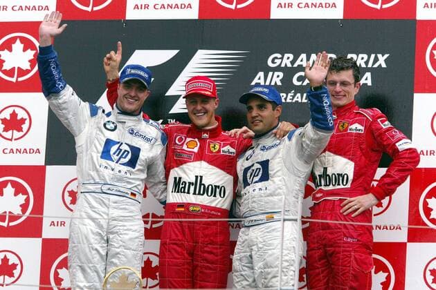 Siegerehrung: v.li.: Ralf Schumacher (BMW-Williams), Michael Schumacher (beide Deutschland Ferrari), Juan Pablo Montoya (Kolumbien BMW-Williams) und Renningenieur Chris Dyer (Australien Ferrari) Motorsport Grand Prix Herren Großer Preis von Kanada 2003, Formel 1 Weltmeisterschaft, F1, F, GP, WM, Vdig Gruppe Montreal Freude,