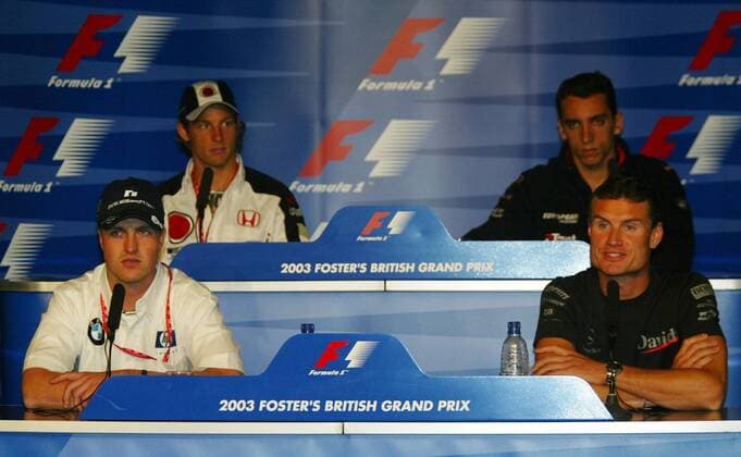 V.li.: Ralf Schumacher (Deutschland BMW-Williams), Jenson Button (England BAR-Honda), Justin Wilson (England Minardi-Cosworth) und David Coulthard (Schottland McLaren Mercedes) auf der Pressekonferenz zum Großen Preis von Großbritannien Motorsport Grand Prix Herren Großer Preis von England 2003, Formel 1 Weltmeisterschaft, F1, F, GP, WM, Vdig Gruppe Silverstone