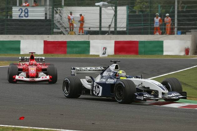 Ralf Schumacher (BMW-Williams, re.) vor Bruder Michael Schumacher (beide Deutschland Ferrari) Motorsport Grand Prix Herren Großer Preis von Japan 2003, Formel 1 Weltmeisterschaft, F1, F, GP, WM Gruppe Suzuka Dynamik,