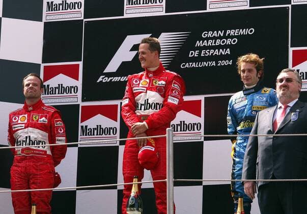 Siegerehrung beim GP von Spanien 2004, v.li.: Rubens Barrichello (Brasilien), Sieger Michael Schumacher (Deutschland beide Ferrari), Jarno Trulli (Italien Renault) Motorsport Grand Prix Herren Großer Preis von Spanien 2004, Formel 1 Weltmeisterschaft, F1, F, GP, WM Gruppe Circuit de Catalunya Barcelona Freude,