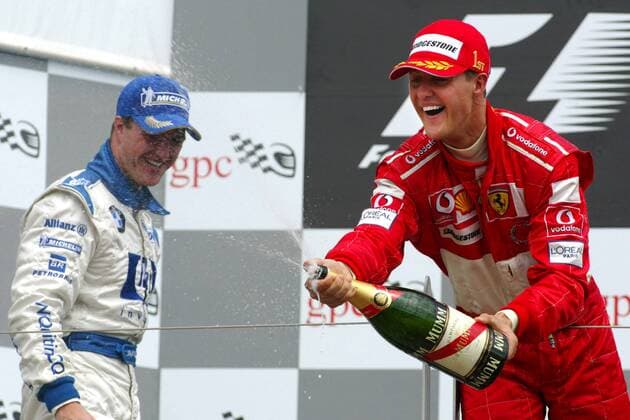 Michael Schumacher (Ferrari, re.) genießt nach seinem Triumph beim Großen Preis von Kanada zusammen mit Bruder Ralf (BMW-Williams, beide Deutschland) die Siegerehrung mit der obligatorischen Sektdusche Motorsport Grand Prix Herren Großer Preis von Kanada 2004, Formel 1 Weltmeisterschaft, F1, F, GP, WM, Vdig Gruppe Montreal Freude,