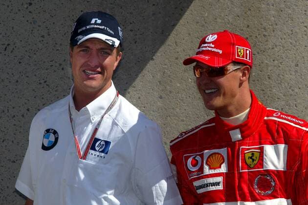 Ralf Schumacher (BMW-Williams, li.) im Gespräch mit seinem Bruder Michael (Ferrari, beide Deutschland) Motorsport Grand Prix Herren Großer Preis von Kanada 2004, Formel 1 Weltmeisterschaft, F1, F, GP, WM, Vdig Gruppe Montreal Freude,
