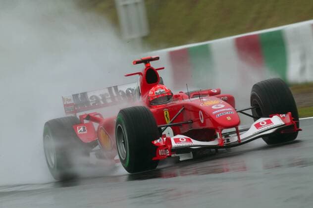 Michael Schumacher (Deutschland Ferrari) mit seinem Boliden auf regennasser Fahrbahn Motorsport Grand Prix Herren Großer Preis von Japan 2004, Formel 1 Weltmeisterschaft, F1, F, GP, WM Einzelbild International Racing Course Suzuka
