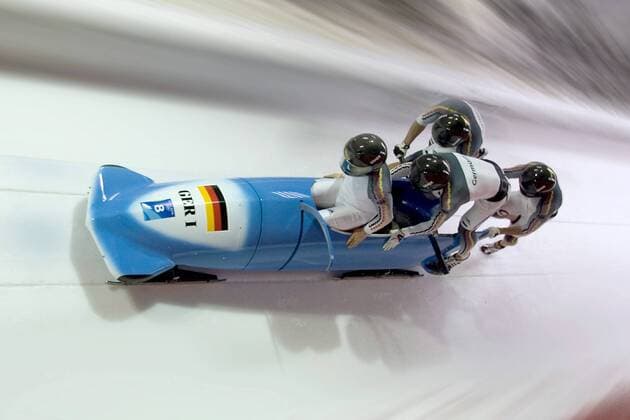 Pilot Andre Lange, Rene Hoppe, Kevin Kuske und Martin Putze (Deutschland 1) - Start Bobsport OS Winter Herren Olympische Spiele Turin 2006, Winterspiele, Bob, Viererbob, Vierer, 4er, 4 er Gruppe Cesana Pariol Dynamik,