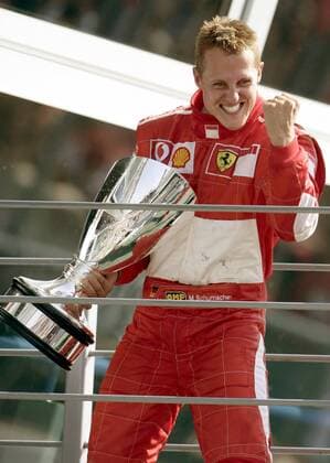Siegerehrung nach dem GP von Italien in Monza 2006 - Sieger Michael Schumacher (Deutschland Ferrari) jubelt mit seinem Pokal Motorsport Grand Prix Herren Großer Preis von Italien 2006, Formel 1 Weltmeisterschaft, F1, F, GP, WM Einzelbild Monza Freude, Begeisterung, Motorsport Grand Prix Herren Großer Preis von Italien 2006, Formel 1 Weltmeisterschaft, F1, F, GP, WM Einzelbild Monza Freude, Begeisterung,