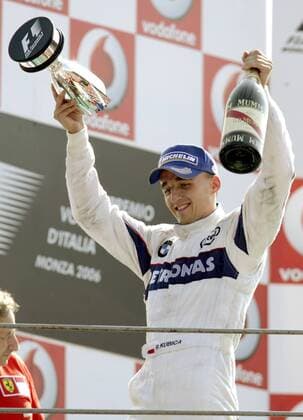 Siegerehrung nach dem GP von Italien in Monza 2006 - Robert Kubica (Polen BMW Sauber) jubelt mit seinem Pokal und einer Champagnerflasche Motorsport Grand Prix Herren Großer Preis von Italien 2006, Formel 1 Weltmeisterschaft, F1, F, GP, WM Einzelbild Monza Freude, Motorsport Grand Prix Herren Großer Preis von Italien 2006, Formel 1 Weltmeisterschaft, F1, F, GP, WM Einzelbild Monza Freude,