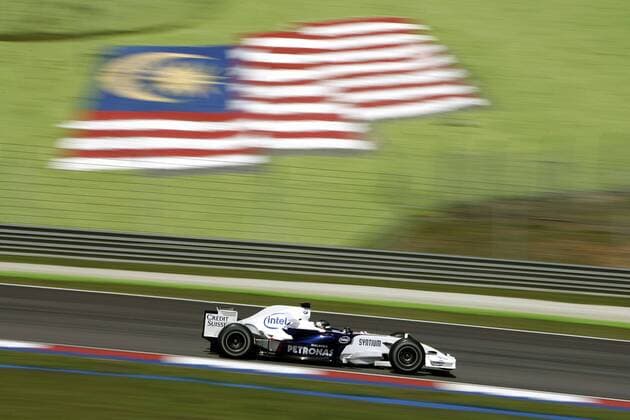 Unter Malaysischer Flagge - Testfahrer Sebastian Vettel (Deutschland BMW Sauber) in seinem Boliden Motorsport Grand Prix Herren Großer Preis von Malaysia 2007, Formel 1 Weltmeisterschaft, F1, F, GP, WM, freies Training Einzelbild International Circuit Sepang Kuala Lumpur Dynamik, Motorsport Grand Prix Herren Großer Preis von Malaysia 2007, Formel 1 Weltmeisterschaft, F1, F, GP, WM, freies Training Einzelbild International Circuit Sepang Kuala Lumpur Dynamik,