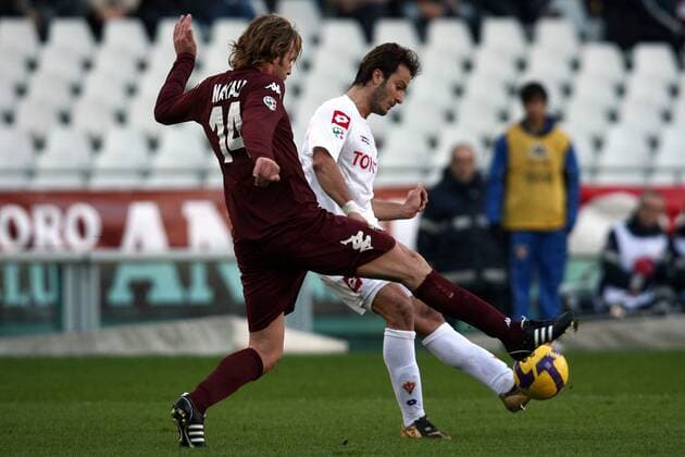 Alberto Gilardino (AC Florenz, re.) gegen Cesare Natali (FC Turin) -  Fußball Herren Serie A 2008 2009, 1. Italienische Liga, Torino FC - ACF Fiorentina 1:4, AC Florenz Gruppe Turin Dynamik,