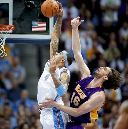 The Denver Nuggets Kenyon Martin (#4) rebounds the basketball in front of the Los Angeles Lakers Pau Gasol (#16) during the second half of Game 4 of the NBA Western Conference Finals in Denver, Co. May 25, 2009. The Nuggets won the game 120-101 to even the series at 2-2. NBA: MAY 25 Western Conference Finals - Lakers at Nuggets - Game 4 Icon141090525020 EDITORIAL USE ONLY