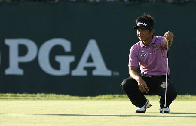 Hiroyuki Fujita of Japan looks at his putt on the 11th green during the PGA Championship  BKX2009081316