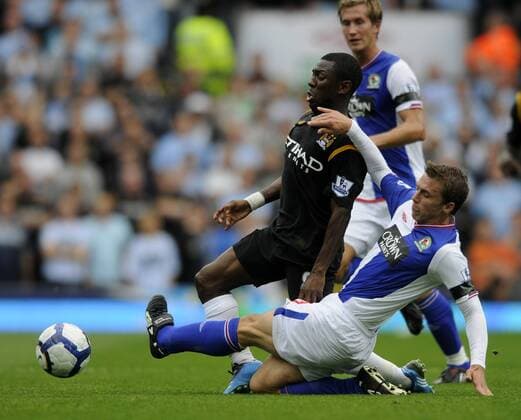 Manchester City s Shaun Wright Phillips (L) is tackled by Blackburn s Stephen Warnock. , Blackburn Rovers v Manchester City 15th August, 2009 EDITORIAL USE ONLY. No use with unauthorised audio, video, data, fixture lists, club league logos or live services. Online in-match use limited to 120 images, no video emulation. No use in betting, games or single club league player publications.