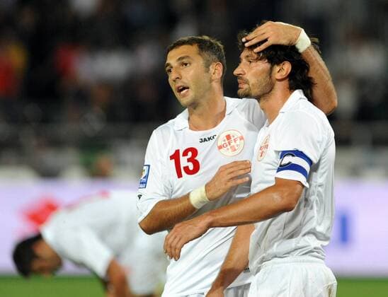 Kakha Kaladze of Georgia (R) reacts after scoring two calamitous own goals  o0 Enttäuschung