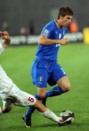 Davide Santon of Italy drives the ball 