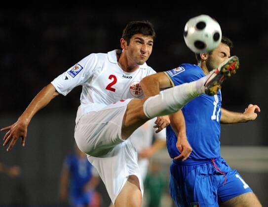 Ucha Lobjanidze (L) of Georgia vies with Giuseppe Rossi of Italy 