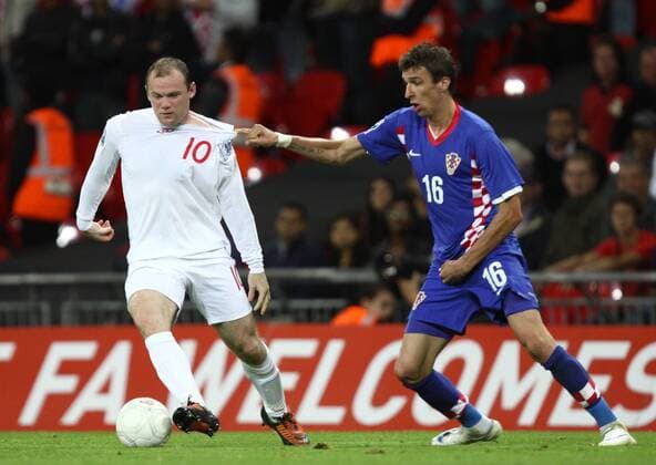 Wayne Rooney (England, L) and Mario Mandzukic (Croatia). 