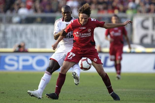 Livorno 12 09 2009 - Serie A AC Livorno (red) - AC Milan Cristian Raimondi (R) - Clarence Seedorf 