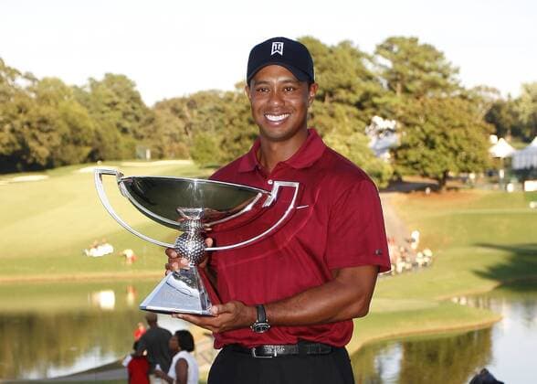 Tiger Woods (USA) stands with his Fed Ex trophy in the final round of the FedEx Cup 2009 in Atlanta - Icon4880909270628 EDITORIAL USE ONLY