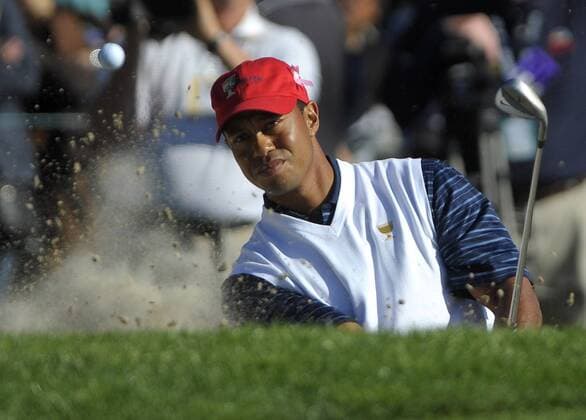 United States team member Tiger Woods hits from a bunker on the 14th fairway during the second round of The Presidents Cup at Harding Park Golf Course in San Francisco, California on October 9, 2009.  SFP20091009340 o0 USA, Eldrick o00 The President s