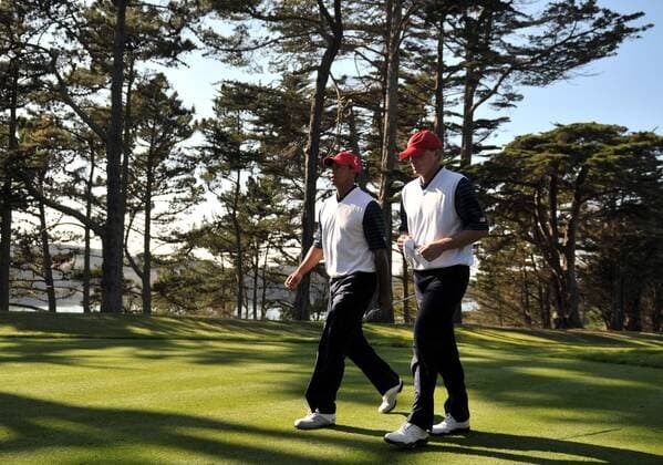 United States team member Tiger Woods (L) walks with his teammate Steve Stricker during the second round of The Presidents Cup at Harding Park Golf Course in San Francisco, California on October 9, 2009.  SFP20091009322 o0 USA, Eldrick o00 The President s