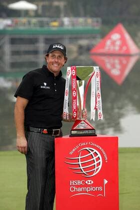 Phil Mickelson of the USA poses next to the trophy after winning the HSBC Champions golf tournament in Shanghai -  20091108_71554