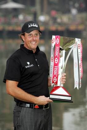 Phil Mickelson of the USA holds the trophy after winning the HSBC Champions golf tournament Shanghai -  20091108_71542