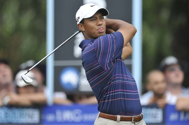 Nov 12, 2009 - Melbourne, Australia - TIGER WOODS (USA) stretches his back a little on his assault on the lead just past the midway point of his first round at the par 4 third hole during the Australian Masters at Kingston Heath Golf Club - ZUMAmm5 o0 Eldrick
