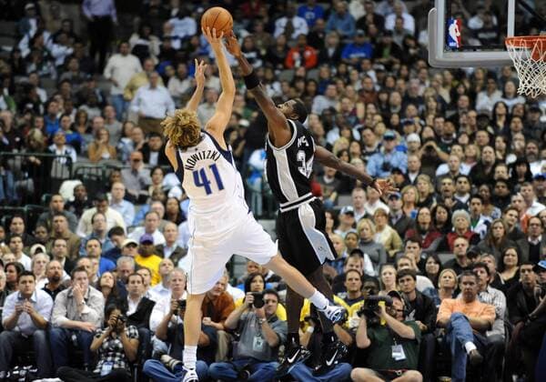 November 18, 2009: Dallas Mavericks forward Dirk Nowitzki 41 has a shot blocked by San Antonio Spurs center Antonio McDyess 34 during an NBA game between the San Antonio Spurs and the Dallas Mavericks at the American Airlines Center in Dallas, TX Dallas defeated San Antonio 99-94 in OT - ZUMAcp2