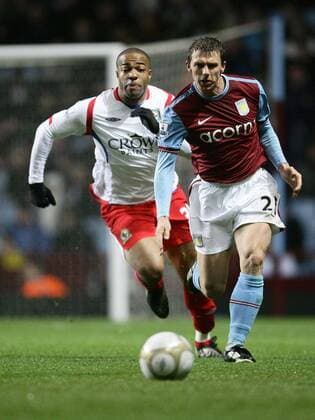 Stephen Warnock (R) of Aston Villa is chased by Macacieo Rigters of Blackburn EON FA Cup 3rd Round Aston Villa v Blackburn Rovers 2nd January, 2010 EDITORIAL USE ONLY. No use with unauthorised audio, video, data, fixture lists, club league logos or live services. Online in-match use limited to 120 images, no video emulation. No use in betting, games or single club league player publications.