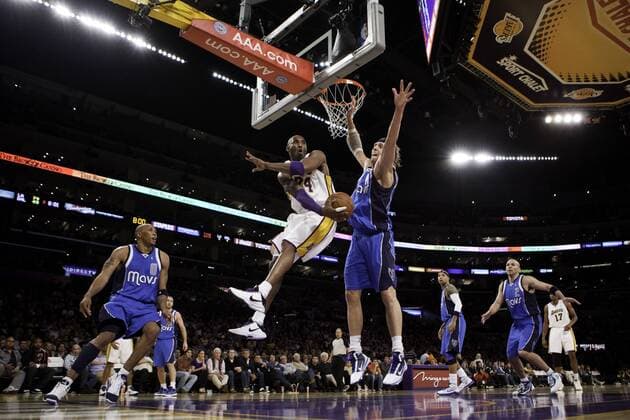 03 January 2010: Guard Kobe Bryant of the Los Angeles Lakers passes the ball behind Dirk Nowitzki of the Dallas Mavericks during the second half of the Lakers 131-96 victory over the Mavericks at the STAPLES Center in Los Angeles, CA. Icon181100103035 EDITORIAL USE ONLY