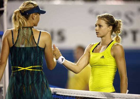 Maria Kirilenko (R) of Russia shakes hands with her compatriot Maria Sharapova after their first round match of women s singles in 2010 Australian Open at Rod Laver Arena in Melbourne Park, Australia  o0 Melbourne