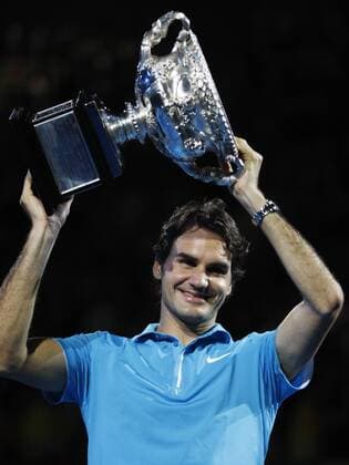 MELBOURNE, Jan. 31, 2010 - Roger Federer of Switzerland holds up the champion trophy during the awarding ceremony after the final match at 2010 Australian Open Tennis Championship at Rod Laver Arena in Melbourne, Australia, Jan. 31, 2010 - 