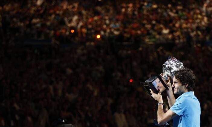 MELBOURNE, Jan. 31, 2010 - Roger Federer of Switzerland holds up the champion trophy during the awarding ceremony after the final match at 2010 Australian Open Tennis Championship at Rod Laver Arena in Melbourne, Australia, Jan. 31, 2010 - 