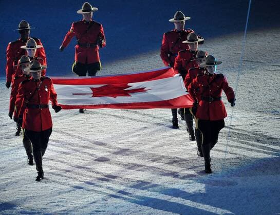 Feb. 12, 2010 - Whistler, BC, Canada - VANCOUVER, BC: FEBRUARY 12, 2010 --The Canadian flag is brought into the stadium to kick off the opening ceremony of the 2010 Winter Olympics, February 12, 2010 at BC Place in Vancouver, BC. - ZUMAw51 o0 Fahne, Nationalfahne Mountie
