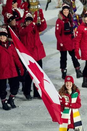 12 February 2010: Team Canada led by flag bearer Clara Hughes. The Opening Ceremony of the XXI Olympic Winter Games, the Vancouver 2010 Winter Olympics, held in BC Place Stadium in Vancouver. Icon109100212085 o0 Einmarsch Delegation Fahnenträger Objekte Fahne, Nationalfahne Eisschnelllauf Damen EDITORIAL USE ONLY