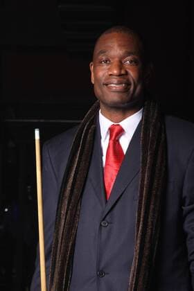 Feb 11, 2010 - Dallas, Texas, USA - Former NBA player, DIKEMBE MUTOMBO, of the Houston Rockets during the 5th Annual Zo & Magic s 8-Ball Challenge at the Fair Park Centenial Hall. - ZUMAv80