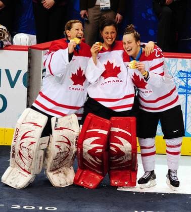 L to R: Olympic champions Kim St. Pierre, Charline Labonte and Marie Philip Poulin (Canada) celebrate at Canada Hockey Place in Vancouver, Canada, during the 2010 Winter Olympics on February 25, 2010. Canada defeated USA 2-0 to win the goldmedal. OLY2010022552 o0 Jubel, Freude, Sieg, Sieger, Olympiasieg, Medaille, Objekte, Goldmedaille