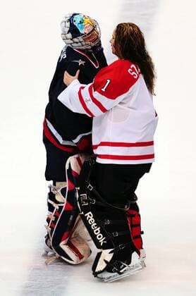 Canada s Shannon Szabados (R) shakes hands with USA s Jessie Vetter after Canada beat USA in the women s final at Canada Hockey Place in Vancouver, Canada, during the 2010 Winter Olympics on February 25, 2010. Canada defeated USA 2-0 to win the goldmedal.  OLY2010022551