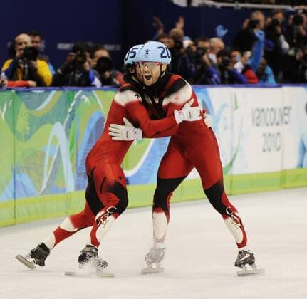 Canadian skaters Charles Hamelin (L) and Francois-Louis Tremblay (R) celebrates their goldmedal win in the Men s 5000 M relay short track speed skating - - ZUMAw51 o0 Jubel Freude Sieg Olympiasieg