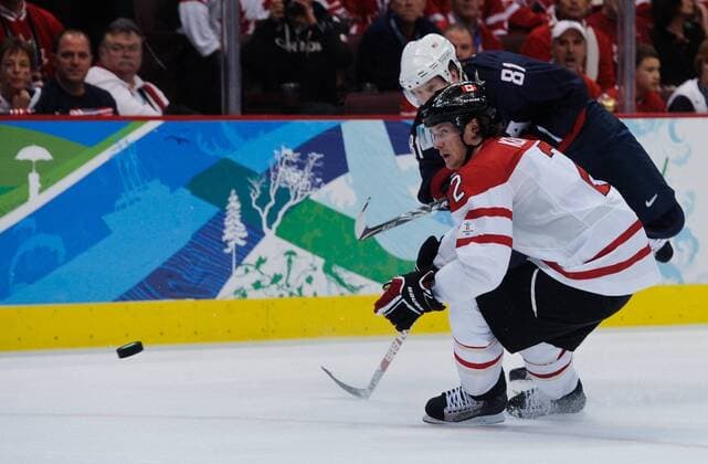 Phil Kessel (Rear) of the USA shoots during the men s icehockey goldmedalgame with Canada at the 2010 Winter Olympic Games in Canada Hockey Place, Vancouver, Canada, Feb. 28, 2010. . (34) 