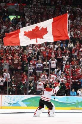 Feb. 28, 2010 - Vancouver, BC, Canada - Canada s goalie ROBERTO LUONGO skates off with the flag as Canada s celebrates after Canada beat the USA in the men s Goldmedal hockey match at Canada Hockey Place in Vancouver, BC during the 2010 Winter Olympics, February 28, 2010. - ZUMAw51 o0 Fahne, Nationalfahne, Objekte Sieg, Sieger, Olympiasieg, Olympiasieger, Freude