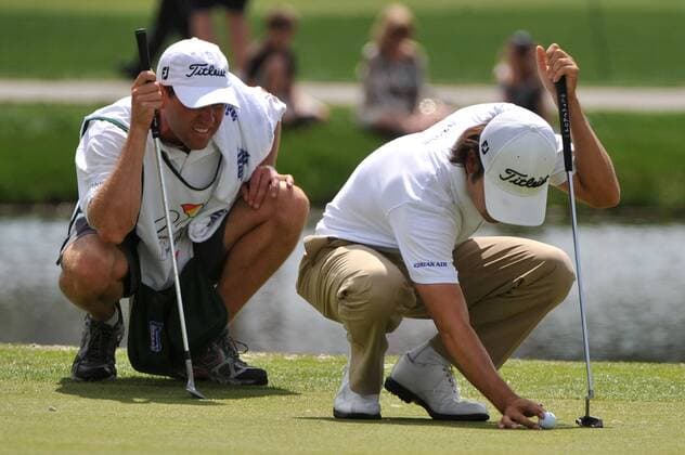 Kevin Na (USA) and his caddy Kenny Harms line up a putt on the 17th green during the second round of the Arnold Palmer Invitational at the Bay Hill Club and Lodge in Orlando, Florida on March 26, 2010.  ORL20100326332
