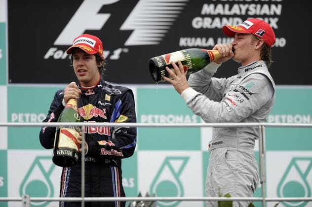 Sieger Sebastian VETTEL (GER),Red Bull Racing (li) feiert mit dem Drittplatzierten Nico ROSBERG (GER) Mercedes GP Petronas - Rennen, Formel 1, GP von Malaysia, Sepang, 04.04.2010 o0 Sieg, Sieger, Siegerehrung Freude
