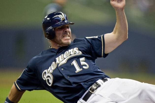 April 07, 2010- Milwaukee, WI. Miller Park..Milwaukee Brewers Jim Edmonds 15 slides into third base. .Milwaukee Brewers won over the Colorado Rockies 5-4, taking 2 out 3 games in the home opener at Miller Park.. - ZUMAcc9