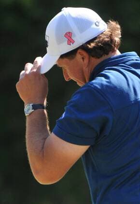 Phil Mickelson USA acknowledges the gallery on the 4th green during the second round of the Quail Hollow Tournament in Charlotte, North Carolina on April 30, 2010.  CHA20100430309