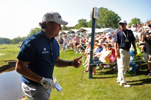 Phil Mickelson USA gives acknowledges the gallery after putting on the 18th green during the second round of the Quail Hollow Tournament in Charlotte, North Carolina on April 30, 2010.  CHA20100430305