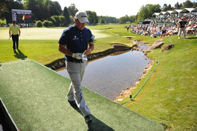 Phil Mickelson USA leaves the 18th green during the second round of the Quail Hollow Tournament in Charlotte, North Carolina on April 30, 2010.  CHA20100430306