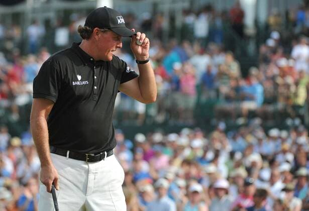 Phil Mickelson (USA) acknowledges the gallery after putting on the 18th green during the final round of the Quail Hollow Tournament in Charlotte, North Carolina on May 2, 2010.  CHA20100502346