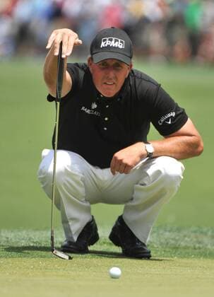Phil Mickelson (USA) lines up a putt on the 1st green during the fourth round of the Quail Hollow Tournament in Charlotte, North Carolina on May 2, 2010.  CHA20100502307