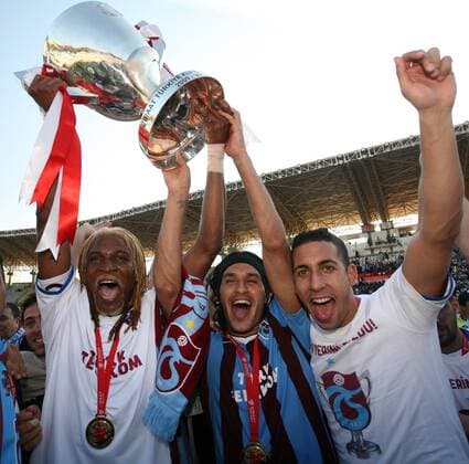 Turkey Ziraat Turkish Cup Final at GAP ARENA Stadium in Sanliurfa, Turkey 05.05.2010 Trabzonspor won 3:1 Pictured: TrabzonSpor Footballers were very happy when they got the cup. Rigobert Song (L), Gustavo Colman ( center) Sezer Badur  o0 Pokalfinale, Trabzon, Türkiye Kupasi